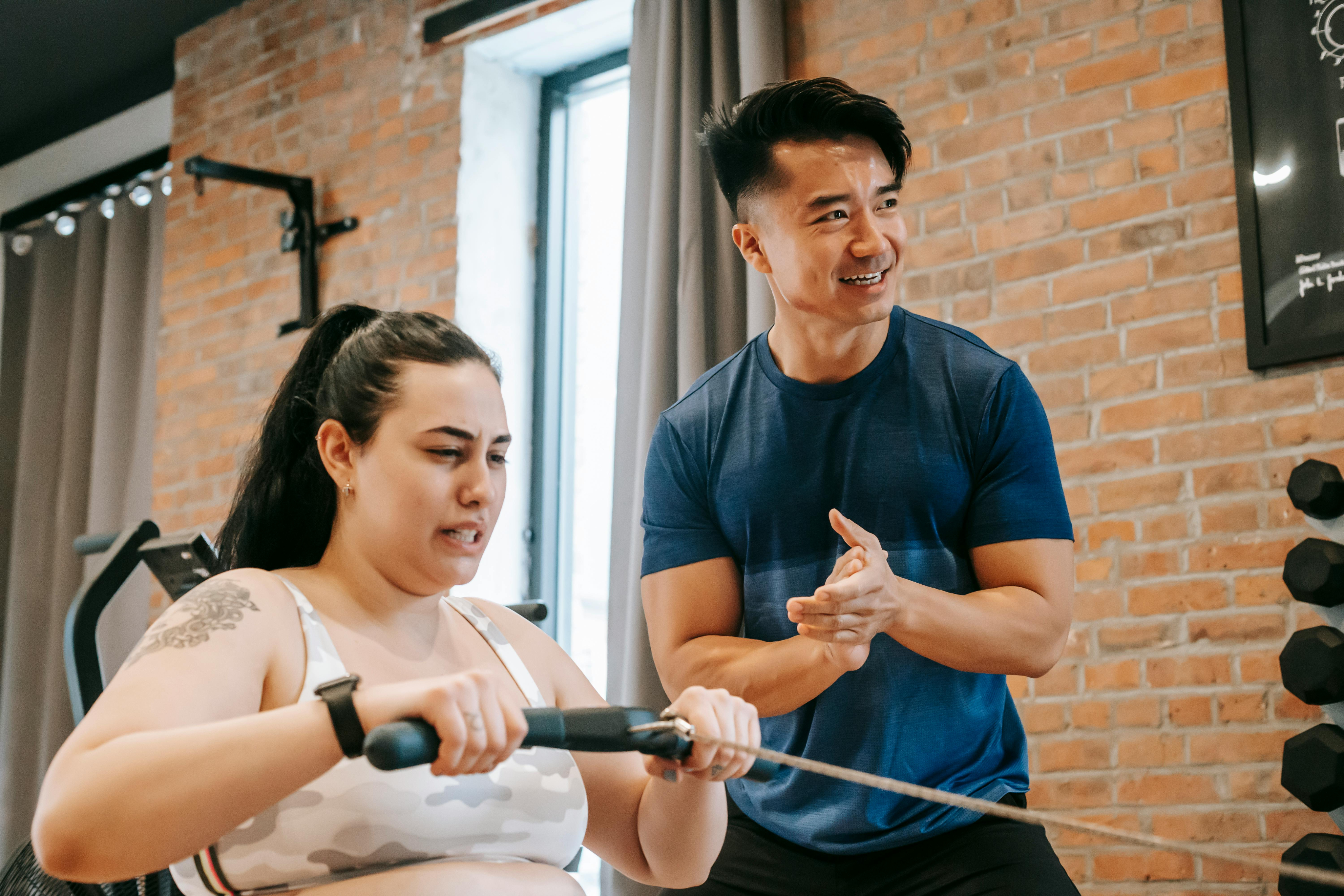 Fitness coach working with a gym member